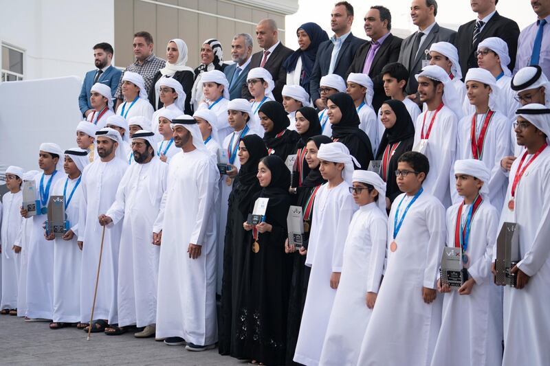 ABU DHABI, UNITED ARAB EMIRATES - June 24, 2019: HH Sheikh Mohamed bin Zayed Al Nahyan Crown Prince of Abu Dhabi Deputy Supreme Commander of the UAE Armed Forces (front row 9th R), stands for a photograph with The UAE School students who won the second place in the World Championship of Artificial Intelligence and Robot Fix, which was held in Kentucky, USA, during a Sea Palace barza. Seen with (front row 10th R).

( Hamad Al Kaabi  / Ministry of Presidential Affairs )
---