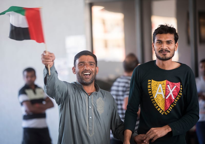 Imtiaz Afsar, right,  a construction worker from India, said he was enjoying the celebrations with his 'new Dubai family'.