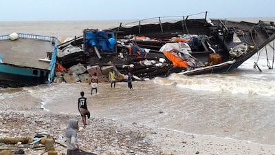 epa06763501 Yemenis inspect a ship wrecked after Cyclone Mekunu hit the island of Socotra, in the Indian Ocean, some 250 miles off the coast of Yemen, 25 May 2018. According to reports, the Yemeni government has declared a state of emergency after tropical Cyclone Mekunu swept through the island of Socotra, leaving at least 40 people missing.  EPA/STRINGER