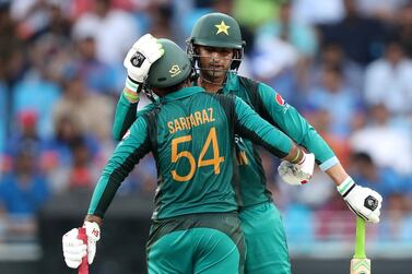 Dubai, United Arab Emirates - September 23, 2018: Pakistan's Shoaib Malik makes 50 and is congratulated by his captain Sarfraz Ahmed (L) during the game between India and Pakistan in the Asia cup. Sunday, September 23rd, 2018 at Sports City, Dubai. Chris Whiteoak / The National