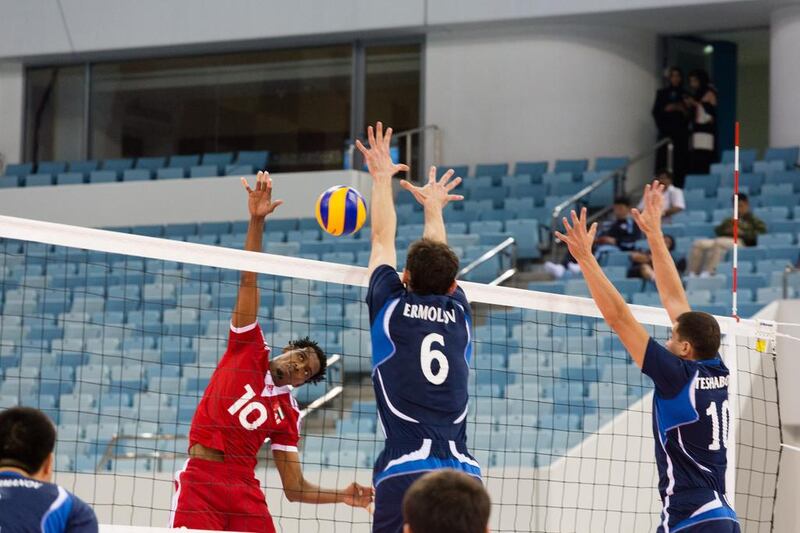 The UAE, in red, opened their campaign at the 17th Asian Senior Men's Volleyball Championships with a 3-1 win over Uzbekistan. The tournament continues through October 6 at Hamdan bin Mohammed Stadium in Dubai. Duncan Chard for The National.