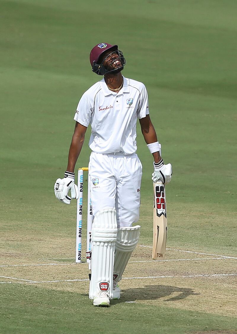 West Indies cricket player Roston Chase reacts after scoring fifty runs during the first day of the second cricket test match between India and West Indies in Hyderabad, India.