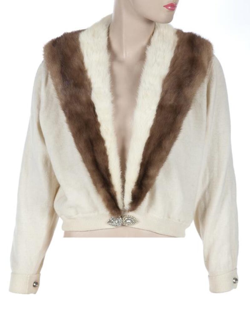 Marilyn Monroe's white wool cardigan with lace and tulle lining. A removable two-tone mink shawl collar lapel attaches with small snaps. Courtesy Julien's Auctions