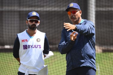 India captain Ajinkya Rahane (L) chats with coach Ravi Shastri ahead of the second Test against Australia in Melbourne. AFP