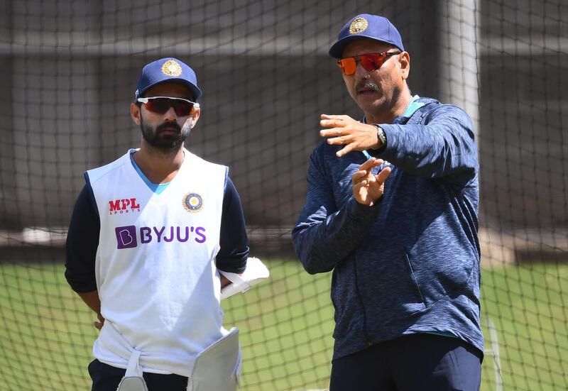 TOPSHOT - India's captain Ajinkya Rahane (L) chats with coach Ravi Shastri (R) during a training session ahead of the second cricket Test match against Australia, in Melbourne on December 24, 2020. --IMAGE RESTRICTED TO EDITORIAL USE - NO COMMERCIAL USE--
 / AFP / William WEST / --IMAGE RESTRICTED TO EDITORIAL USE - NO COMMERCIAL USE--
