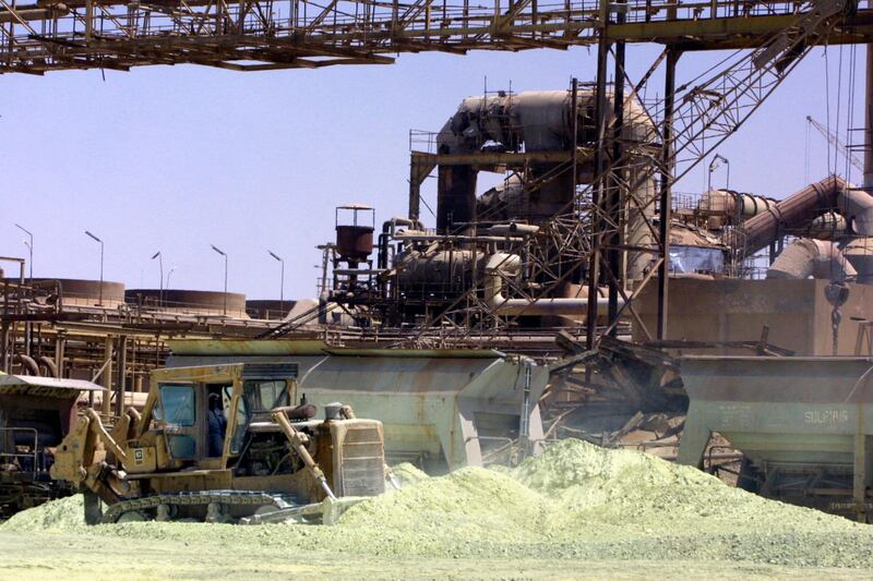 A mechanical digger scoops up phosphate in Al Qaim, Iraq. AFP