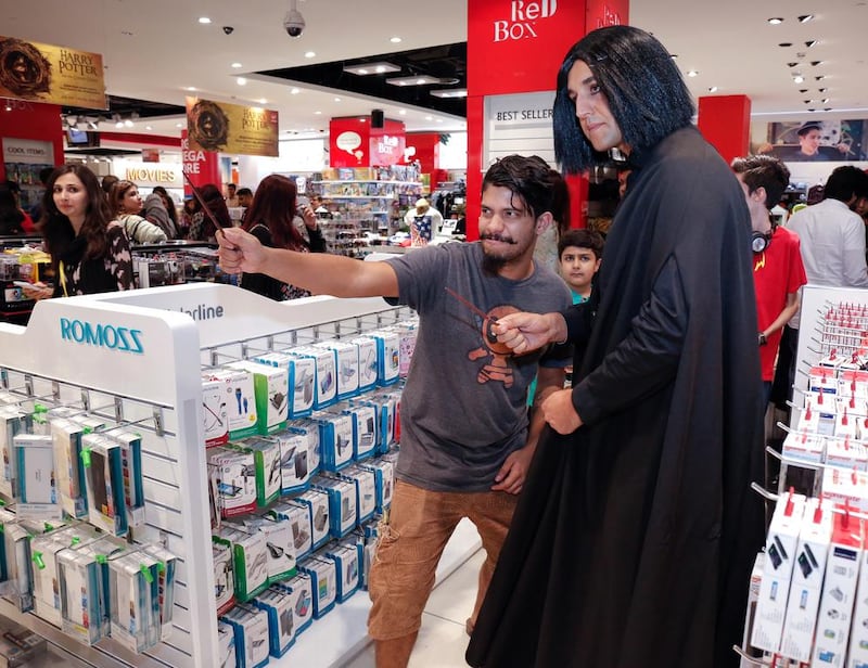 A fan poses with another fan cosplayed as Professor Severus Snape at the Harry Potter and the Cursed Child book launch at the Mall of the Emirates. Victor Besa for The National