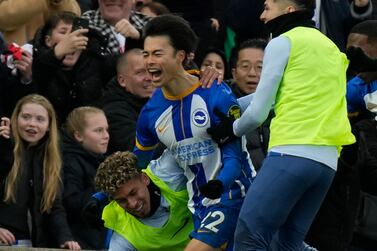 Brighton's Kaoru Mitoma, left, celebrates after scoring his side's second goal during the FA Cup 4th round soccer match between Brighton and Hove Albion and Liverpool at the Falmer Stadium in Brighton, England, Sunday, Jan.  29, 2023.  (AP Photo / Alastair Grant)