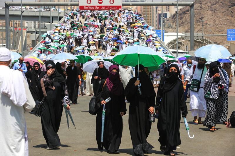 Muslim pilgrims depart after throwing the final pebbles in the symbolic stoning of the devil at the Jamarat Bridge in Mina, near Mecca, which marks the final major rite of the hajj on August 23, 2018. - Muslims from across the world gather in Mecca in Saudi Arabia for the annual six-day pilgrimage, one of the five pillars of Islam, an act all Muslims must perform at least once if they have the means to travel to Saudi Arabia. (Photo by AHMAD AL-RUBAYE / AFP)