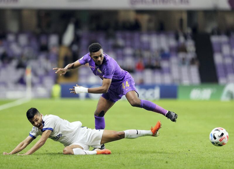 Al Ain, United Arab Emirates - Reporter: John McAuley: Saeed Juma of Al Ain battles with Farrukh Ikramov of Bunyodkor. Al Ain take on Bunyodkor in the play-off to game qualify for the 2020 Asian Champions League. Tuesday, January 28th, 2020. Hazza bin Zayed Stadium, Al Ain. Chris Whiteoak / The National