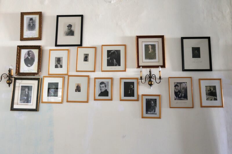 Pictures of famous guests decorate a wall. Reuters