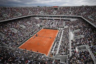 (FILES) In this file photo taken on May 26, 2019 shows a general view of the Philippe Chatrier court, on day 1 of The Roland Garros 2019 French Open tennis tournament in Paris. The French government has discussed a possible "delay of a few days" of this year's French Open with the event organisers, the sports ministry told on April 6, 2021. / AFP / Anne-Christine POUJOULAT