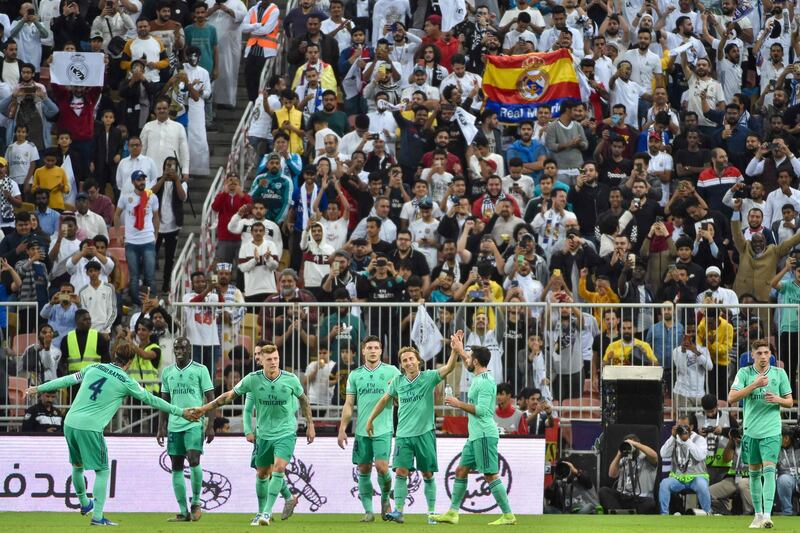 Real Madrid's players celebrate with their fans. AFP