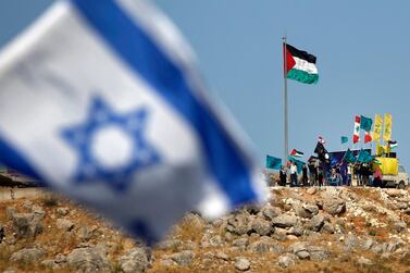 File photo: From the northern Israeli town of Metula near the border with Lebanon, people raising Palestinian, Lebanese and Iran-backed Hezbollah flags during a rally in solidarity with the Palestinians, on the outskirts of the southern Lebanese village of Kfarkila. AFP