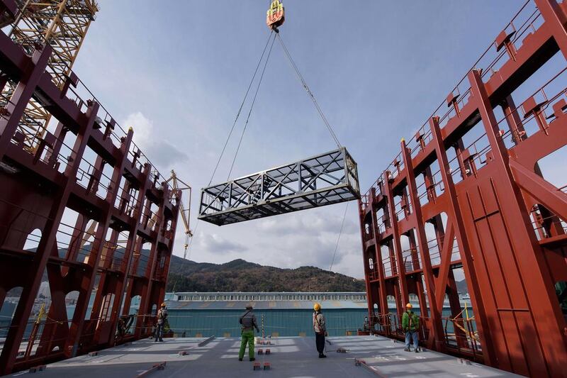 A test container is lowered on to the deck of an under-construction Maersk triple-E class container ship at the Daewoo DSME shipyard in Okpo. Ed Jones / AFP