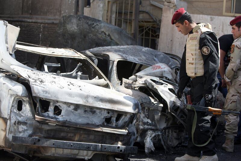 An Iraqi soldier inspects the scene of a "Katyusha" rocket attack that wounded two Iraqis in front of the Ambassador Hotel in Abu Nawas Street in Baghdad on March 29, 2011 where a a delegation of Turkish business people stayed but wasn't hurt, as Turkish Prime Minister Recep Tayyip Erdogan is on a two-days visit in the country.   AFP PHOTO / AHMAD AL-RUBAYE
 *** Local Caption ***  654321-01-08.jpg