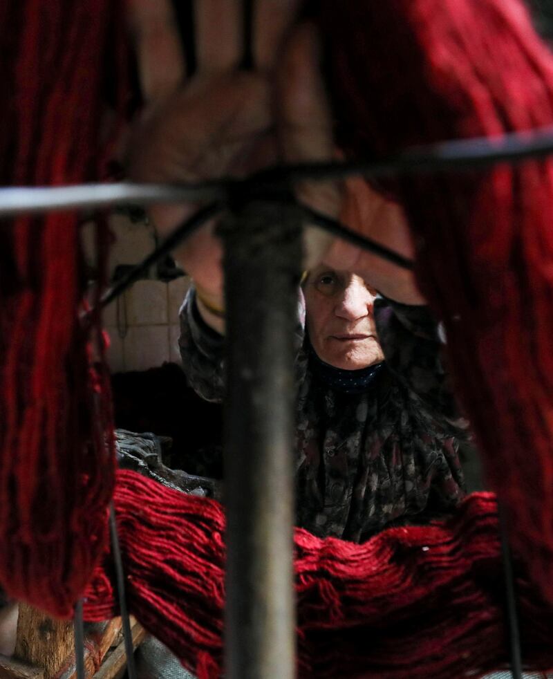 A close up shows Madiha Alkhouly, 76, at work in the village of Atmida, in Dakahliya governorate, Egypt. Reuters