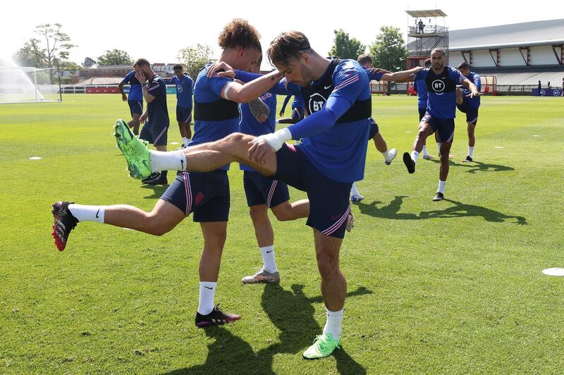 MIDDLESBROUGH, ENGLAND - JUNE 01: Kalvin Phillips and Jack Grealish of England stretch during a training session at an England Pre-Euro 2020 Training Camp on June 01, 2021 in Middlesbrough, England. (Photo by Eddie Keogh - The FA/The FA via Getty Images)