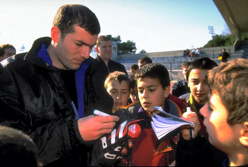 1 Feb 1999:  Zinedine Zidane of Juventus and France signs autographs after being named 1998 FIFA World Player of the Year in Barcelona, Spain. \ Mandatory Credit: Mark Thompson /Allsport