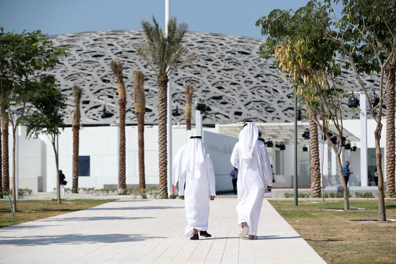Abu Dhabi, United Arab Emirates - November 7th, 2017: Two gentlemen walk towards the Louvre. Louvre press Day. Tuesday, November 7th, 2017 at Louvre, Abu Dhabi. Chris Whiteoak / The National