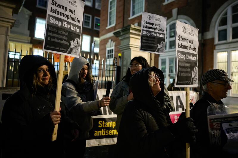 A group of 'Stand Up To Racism' supporters protest outside the Conservative party headquarters in London last month. Getty Images