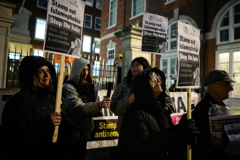A group of 'Stand Up To Racism' supporters protest outside the Conservative party headquarters in London last month. Getty Images