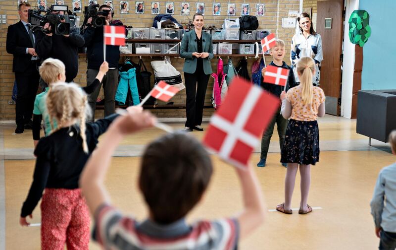 Danish Prime Minister Mette Frederiksen meets with students at Stolpedal school as part of her tour to different places in Jutland, eastern part of Denmark, as the country went into phase two of its reopening, amid the coronavirus disease (COVID-19) outbreak, in Aalborg, Denmark May 18, 2020.  Ritzau Scanpix/Henning Bagger via REUTERS    ATTENTION EDITORS - THIS IMAGE WAS PROVIDED BY A THIRD PARTY. DENMARK OUT. NO COMMERCIAL OR EDITORIAL SALES IN DENMARK.