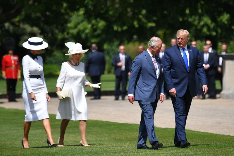Britain's Camilla, Duchess of Cornwall (2L) and Britain's Prince Charles, Prince of Wales (2R) greet US President Donald Trump (R) and US First Lady Melania Trump on their arrival for a welcome ceremony at Buckingham Palace in central London on June 3, 2019, on the first day of their three-day State Visit to the UK. Britain rolled out the red carpet for US President Donald Trump on June 3 as he arrived in Britain for a state visit already overshadowed by his outspoken remarks on Brexit. / AFP / MANDEL NGAN
