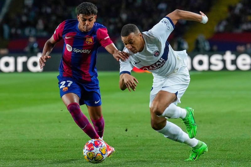 Barcelona's Lamine Yamal, left, in action against PSG's Kylian Mbappe. Yamal was substituted following Ronald Araujo's red card and Barcelona would go on to lose the match 4-1 to be eliminated from the Champions League 6-4 on aggregate. Getty