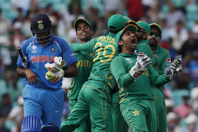 Pakistan's captain Sarfraz Ahmed, right, celebrates the dismissal of India's Ravichandran Ashwin. AP