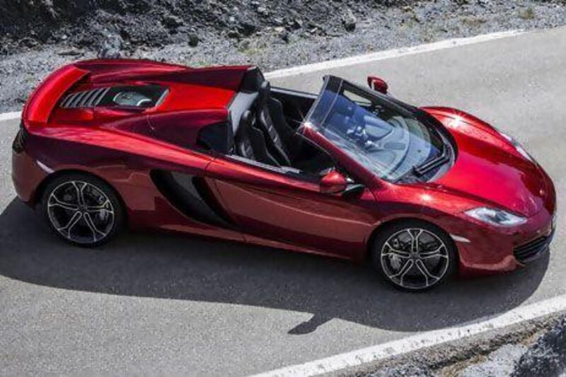 The rear lines of the MP4-12C Spider, especially with the roof stowed, make the car look longer and, arguably, more dramatic than the coupé it's based on. Courtesy McLaren Automotive