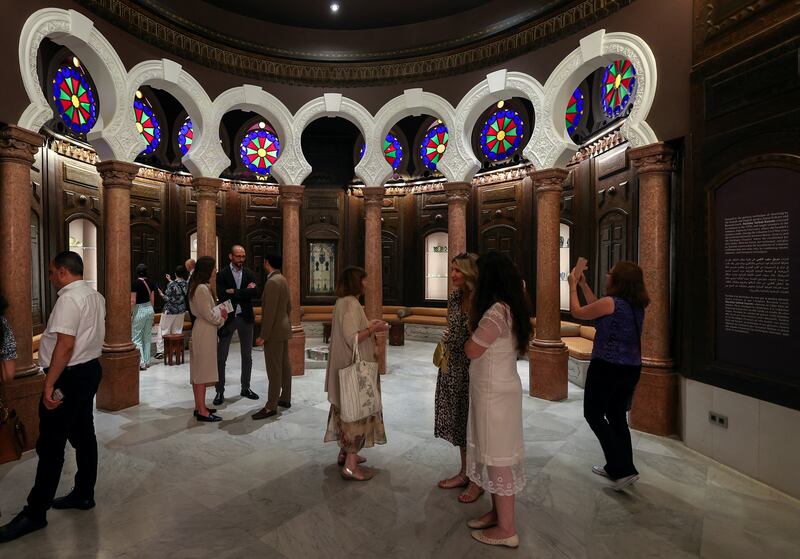 People tour the museum after its reopening. Reuters