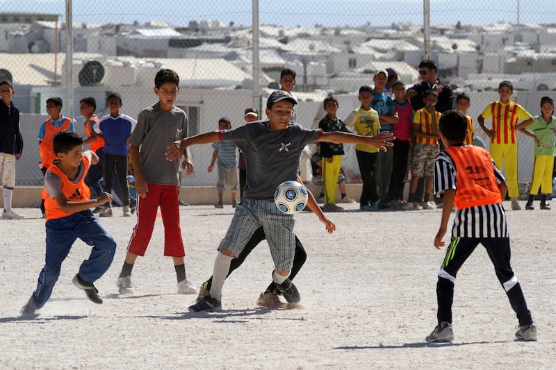 Syrian refugee children play football at the refugee camp in Mafraq. AP