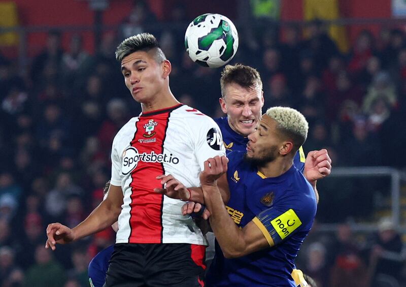 Southampton's Carlos Alcaraz in action with Newcastle United's Dan Burn and Joelinton. Reuters