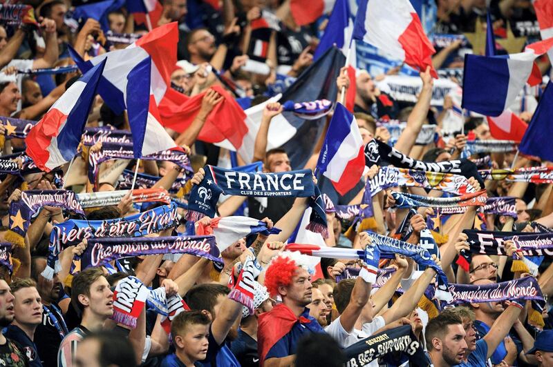 France's supporters cheer and wave French national flags during the UEFA Nations League football match between France and Netherlands at the Stade de France stadium, in Saint-Denis, northern of Paris, on September 9, 2018. / AFP PHOTO / FRANCK FIFE