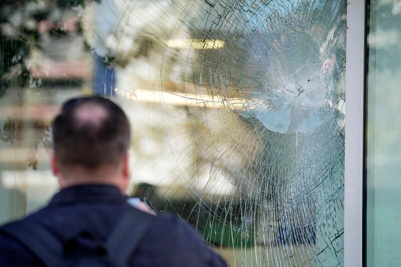 A bullet shattered glass on this office building in Brussels. AP