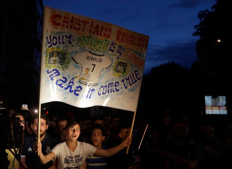 Real Madrid fans welcome their team to Kiev. Sergei Grits / AP Photo