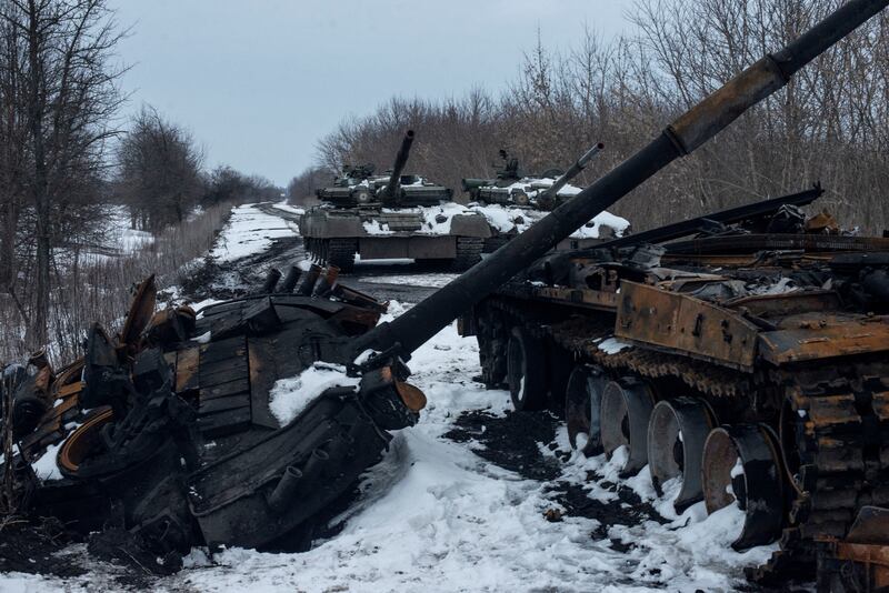 A charred Russian tank and captured tanks in the Sumy region. Reuters