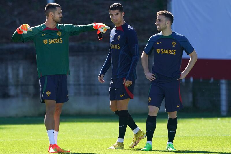 Portuguese goalkeeper Diogo Costa alongside Cristiano Ronaldo and Diogo Jota. EPA