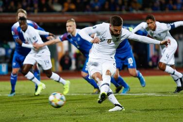 France striker Oli­vier Giroud scores from the spot to earn his side three points against Iceland on Friday. AP