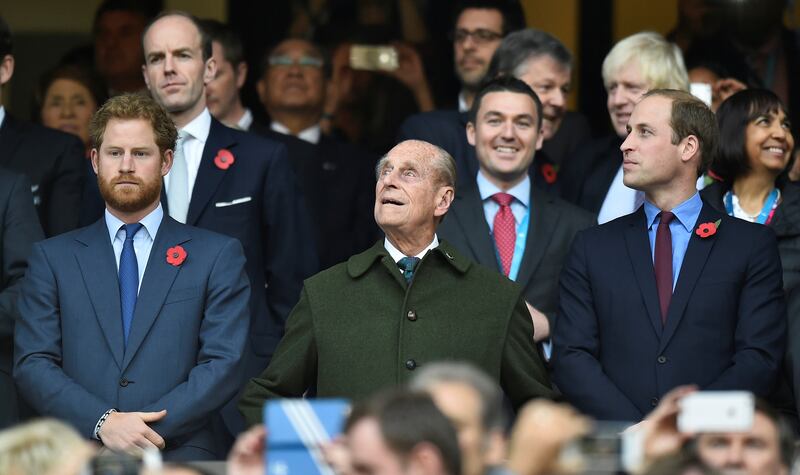 FILE PHOTO: Britain's Prince Harry, Prince Philip and Prince William (L-R) attend the Rugby World Cup final match between New Zealand against Australia at Twickenham in London, Britain October 31, 2015.    REUTERS/Toby Melville/File Photo