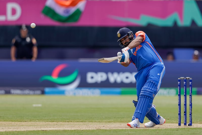 India captain Rohit Sharma hits a six on his way to a total 52 off 37 balls before he retired hurt. AP 