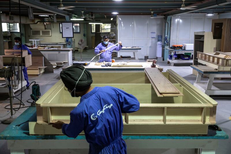 Skilled carpenters create fixtures and fittings for the interior of one of Gulf Craft's luxury yachts.