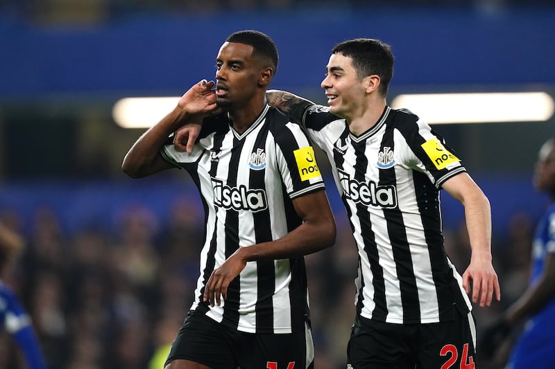 Alexander Isak celebrates with Miguel Almiron after scoring Newcastle's equaliser. PA