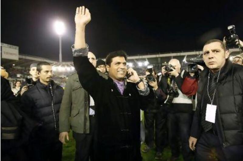 Ahsan Ali Syed, the club's new owner, waves to the fans.
