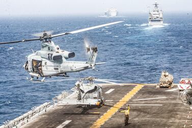 A US Marines UH-1Y Venom helicopter takes off from the flight deck of the US Navy amphibious assault ship USS Boxer during its transit through the Strait of Hormuz. Reuters