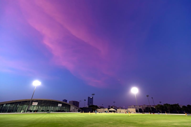 Dubai, United Arab Emirates - Reporter: N/A. Sport. Cricket. Purple sky over the ICC academy during the game between Abu Dhabi and Ajman in the Emirates D10. Friday, July 24th, 2020. Dubai. Chris Whiteoak / The National