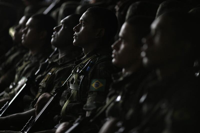 Army soldiers listen to instructions during the operation named ‘Agata’ near the town of Oiapoque, on the border with French Guiana. Ueslei Marcelino / Reuters