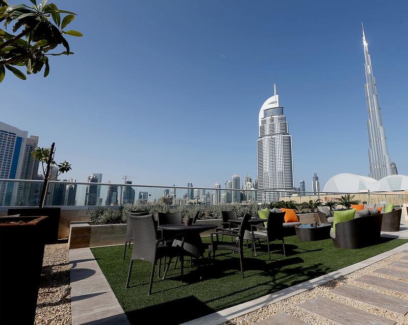 The pool and garden area of the penthouse apartment overlooking Burj Khalifa and The Dubai Mall. Satish Kumar / The National