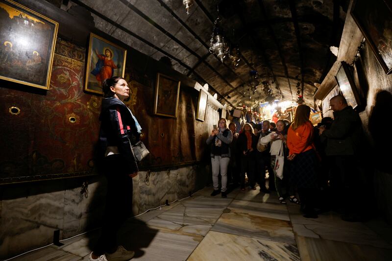 Visitors inside the holy cave at the Church of Nativity in Bethlehem. Reuters